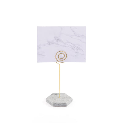 Hexagonal marble card stand with a golden steel column