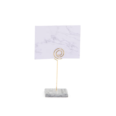 Hexagonal marble card stand with a golden steel column