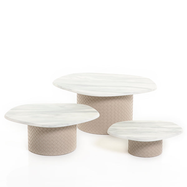 A Set Of 3 beige Leather Stands Diffeent Sizes